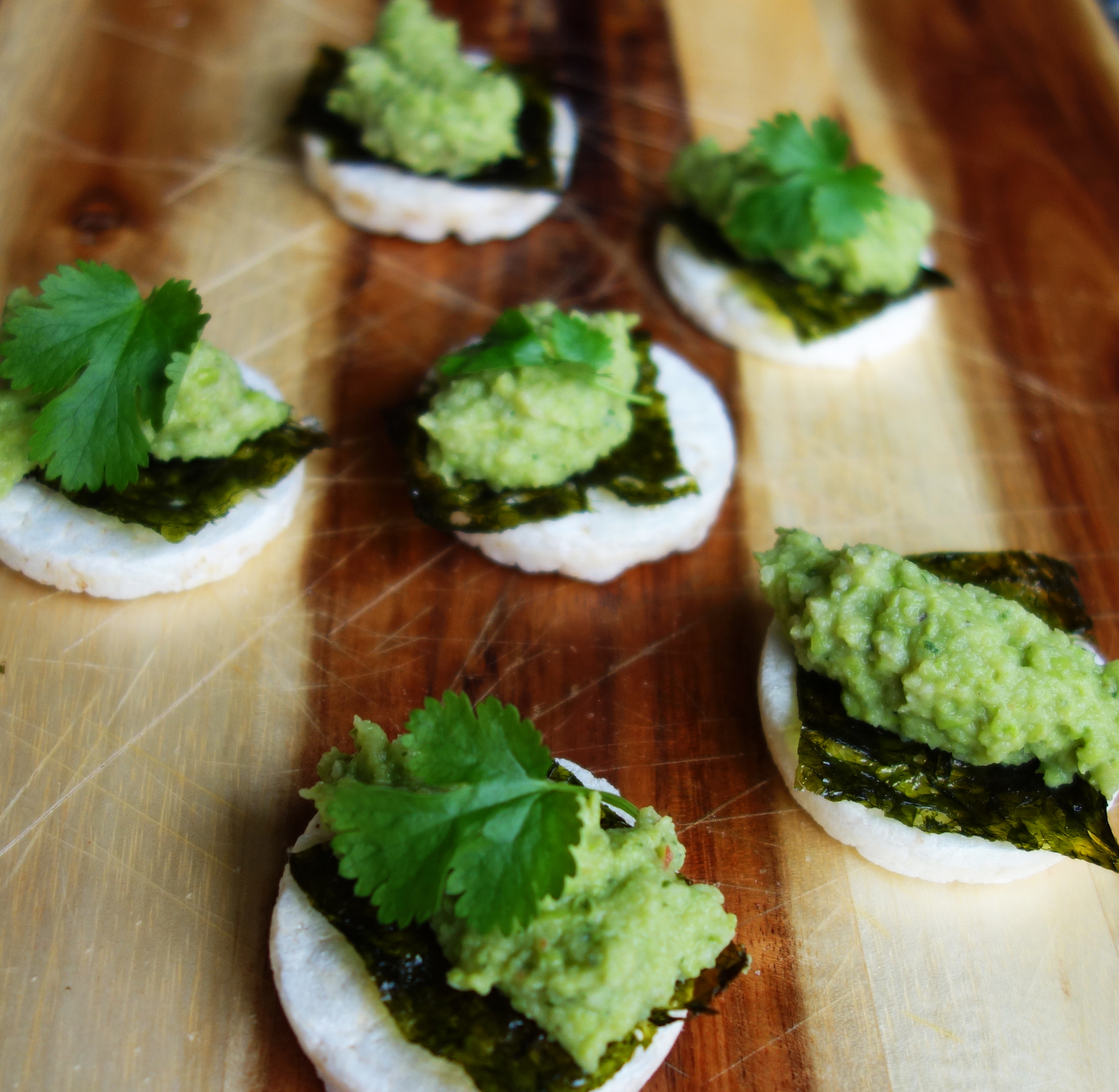 Spicy snack crackers with mashed avocado