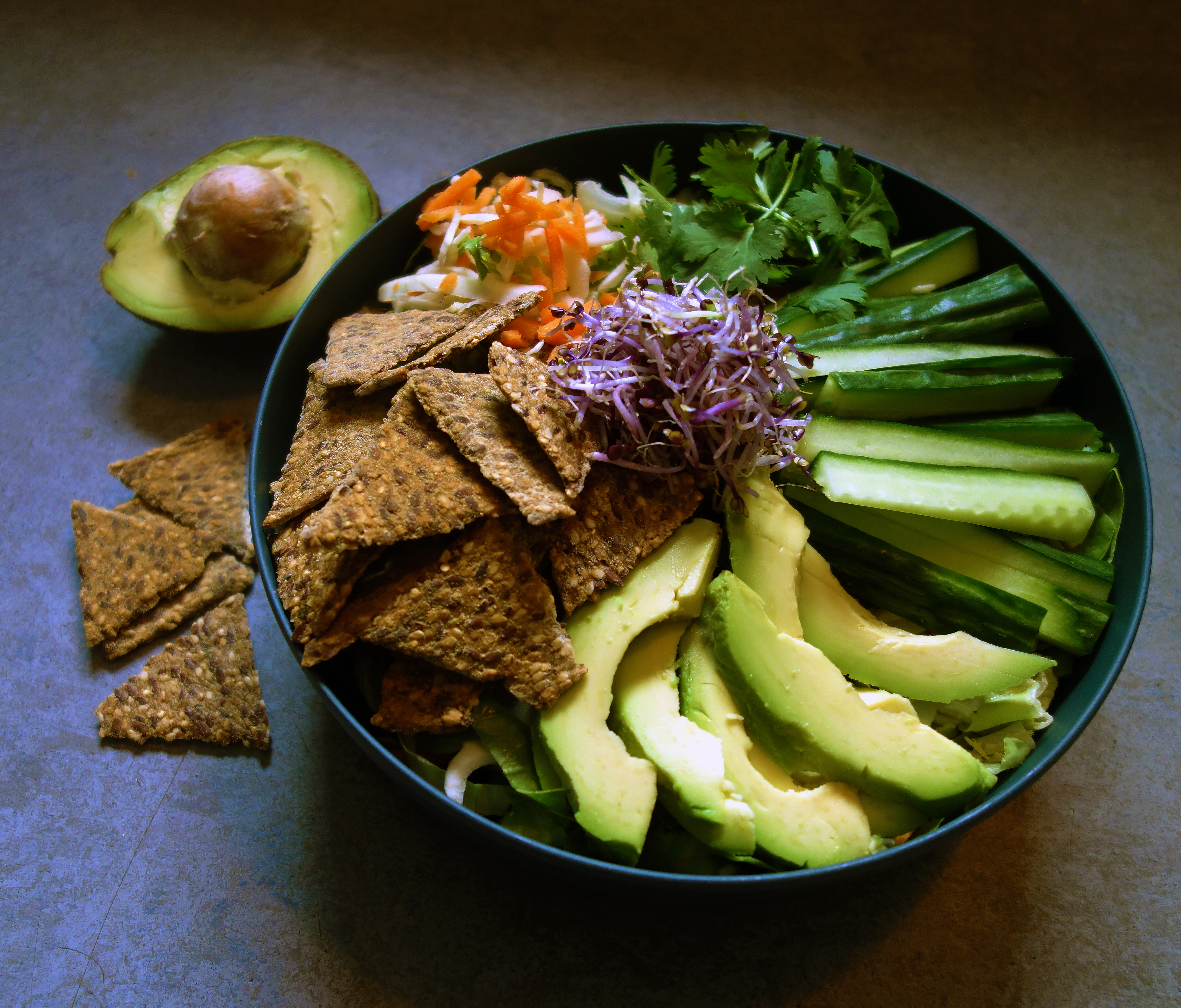 Salad bowl with avocado and a ginger lime dressing